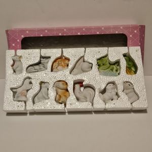 Vintage shiny zodiac figurines.